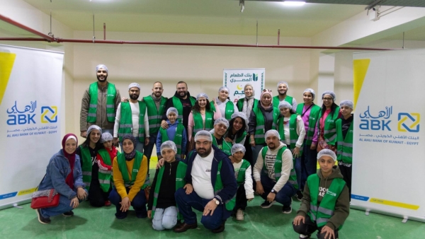  Al Ahli Bank of Kuwait – Egypt employees and their families volunteer to pack Ramadan food boxes in cooperation with Egyptian Food Bank